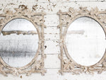 A Pair of Antique Italian Delicately Carved Mirrors with Original Oval Plates