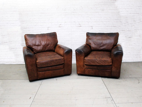 A Pair of Very Large Vintage Brown Leather Armchairs
