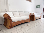 A Superb Pair of Scroll Arm Rattan Upholstered Sofas