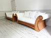A Superb Pair of Scroll Arm Rattan Upholstered Sofas