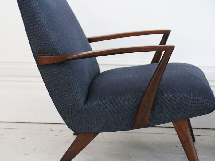 A pair of 1950's rosewood armchairs in the style of Poul Jensen