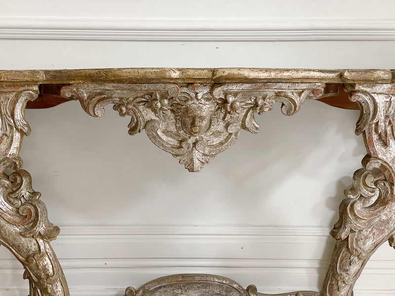 An early 18th Century Italian Pair of Carved Silver Gilt Console Tables