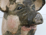 A large, carved wood promotional Pig figure