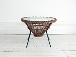 A 1950's rattan table with glass top on tripod legs by Franco Albini