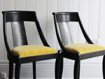 A Set of Eight Black Lacquered 1920's French Dining Chairs
