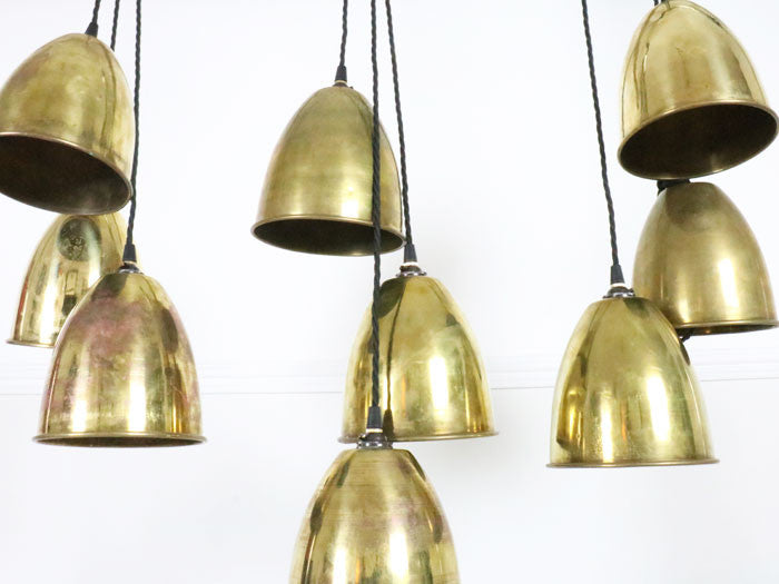 A set of 9 early 20th C brass pendant lights