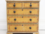 A small Regency Painted Faux Bamboo chest of drawers