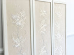 A Set of Three Framed Muted Floral Japanese Embroidered Panels