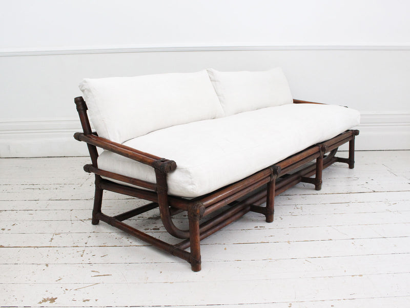 A 1950's French Bamboo Sofa and Pair of Armchairs