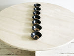 Seven Black Small Ceramic Bowls with Circle DetailSeven Black Small Ceramic Bowls with Circle Detail