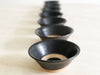 Seven Black Small Ceramic Bowls with Circle Detail
