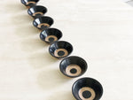 Seven Black Small Ceramic Bowls with Circle Detail
