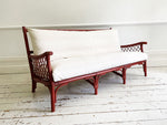 A 1960's French Dark Raspberry Rattan & Bamboo Three Seater Sofa