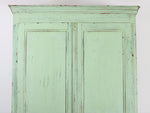 A 19th century French green painted cupboard