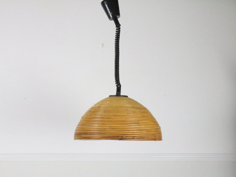 A large 1960's rise and fall rattan pendant light 