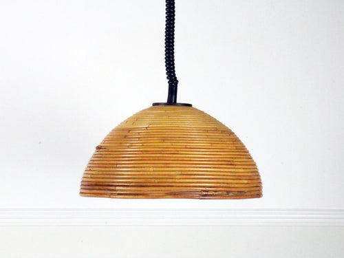 A large 1960's rise and fall rattan pendant light 