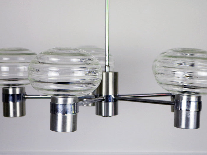 A 1970's French steel and glass five headed chandelier