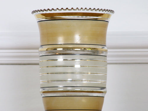 A vintage French glass vase with gold and white decoration