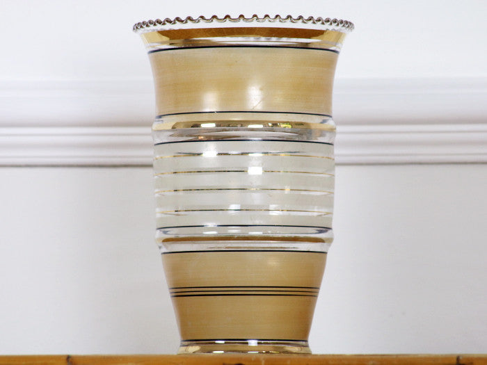 A vintage French glass vase with gold and white decoration